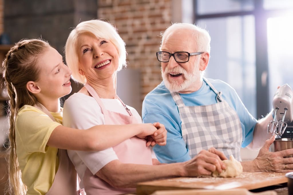 Grandparents Laughing with Their Grandchild